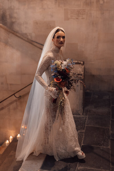 Wedding photographer captures couple taking a stroll hand in hand at their french chateau wedding.
