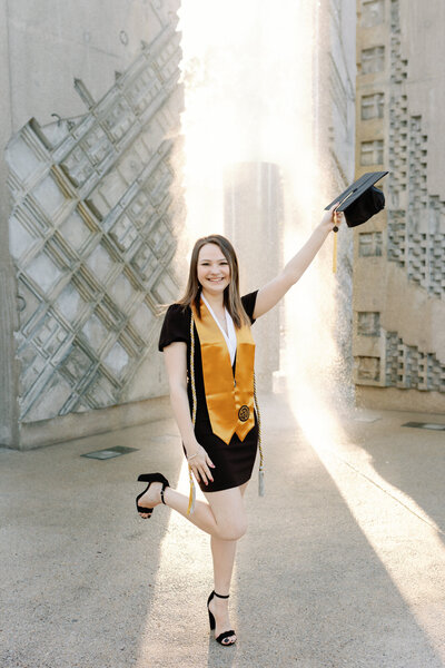 Senior Purdue Girl Graduate Posing In Front of the Engineering Fountain in West Lafayette Indiana
