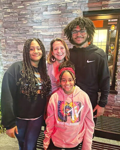 Picture of Keri with her nieces and nephew