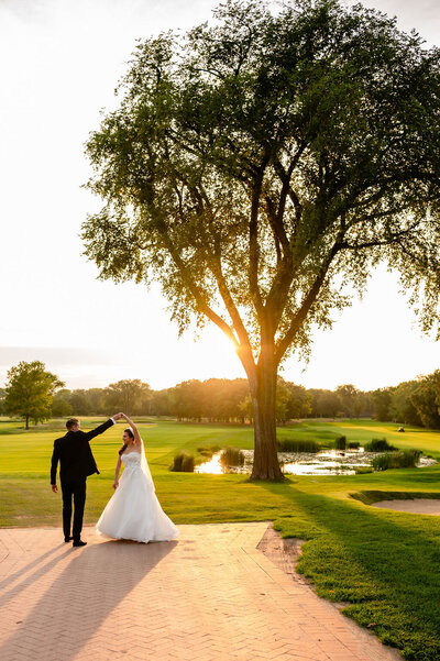 Bride and groom dance at sunset at the Skokie Country Club in Glencoe, IL