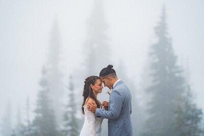 couple kissing under snoqualmie falls