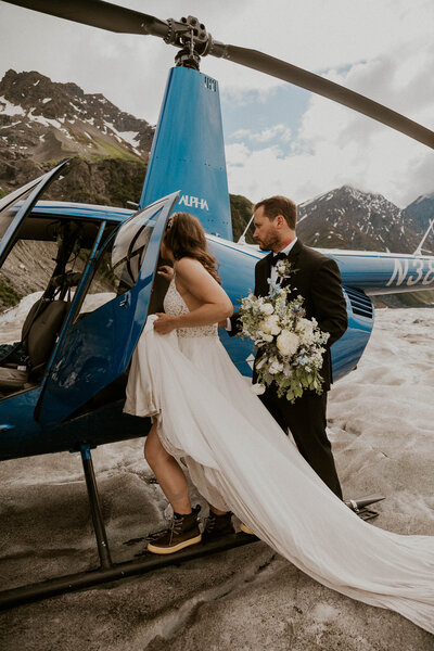 bride and groom on glacier