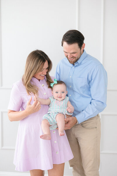 Portrait of a new mom holding her sleeping baby boy by northern kentucky newborn photographer missy marshall