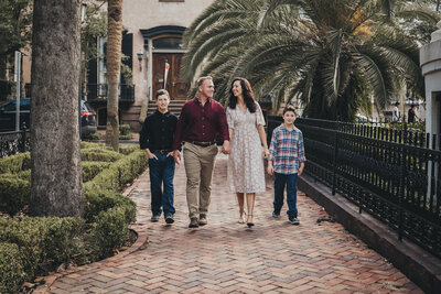 family walking along for family photo session at hilton head