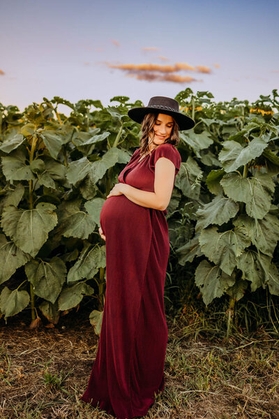 maternity dress and hat sunflower session