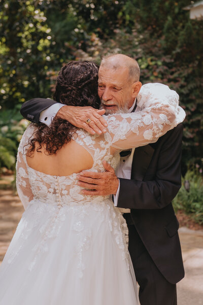 A couple cuts a cake together on their wedding day