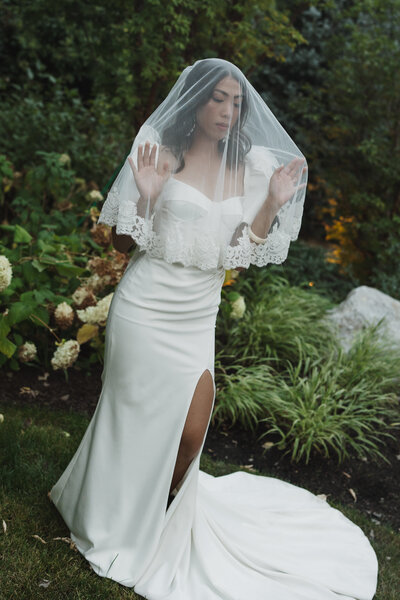 Bride posing with veil in Big Sky, MT photographed by best montana wedding photographer