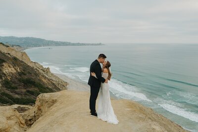 bride and groom at san diego sand cliffs