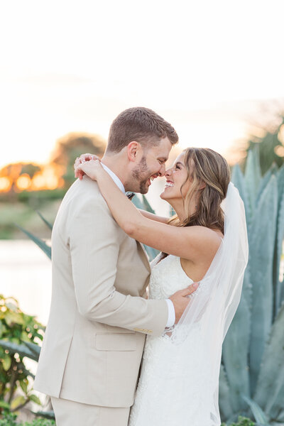 an engaged couple walking with their arms linked