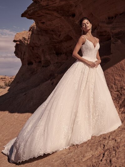 Elegant soft Mikado features a contrasting beaded bodice and illusion hemline on this strapless gown.