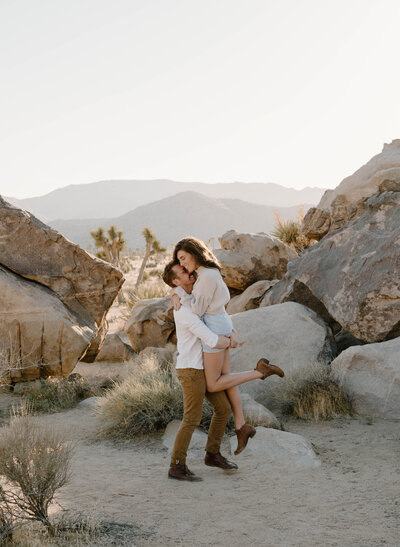 Joshua Tree National Park engagement photos of a young couple with a trendy, boho style