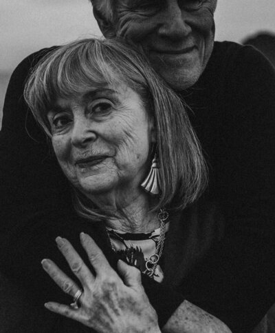 portrait of grandparents elderly married couple in love smiling and hugging by maryland photographer