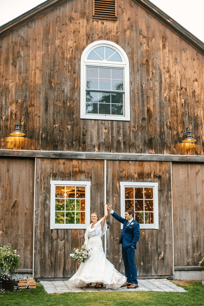 Locke Halls Farm - Bride & Groom Doing A Twirl In Front of Barn Setting