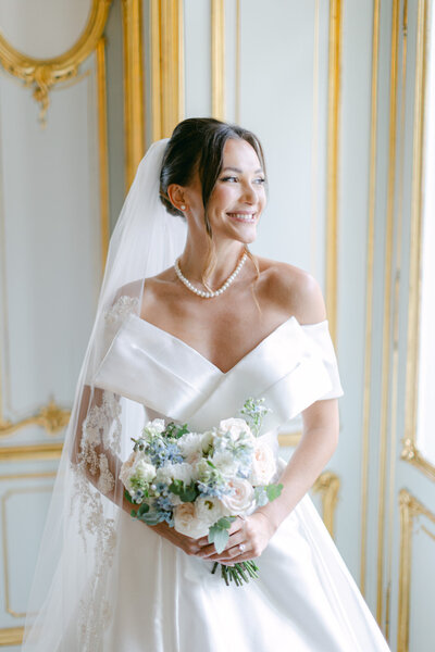 Eclat Destination Wedding bride smiling at getting ready at palace Coburg in Vienna