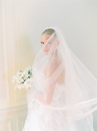 Bride with bouquet and train