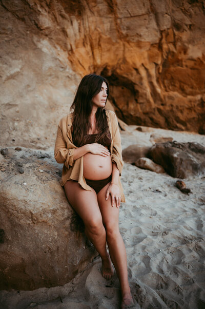 woman holding belly