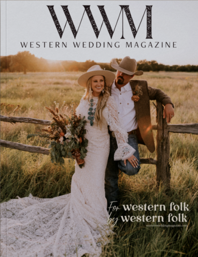 bride and groom posing on fence