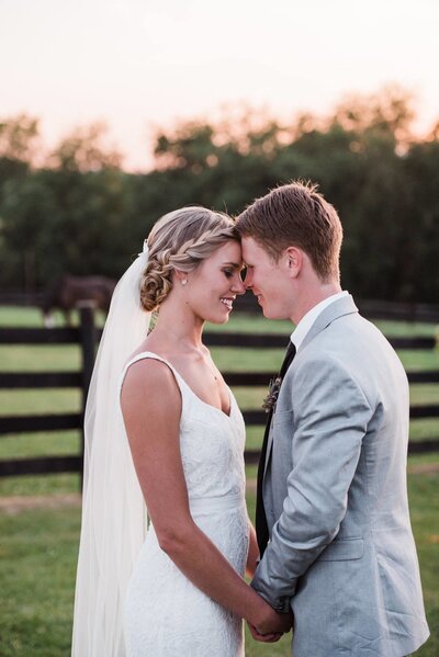 bride and groom at horse farm