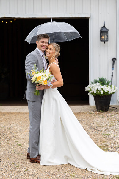 bride and groom umbrella portrait minnesota