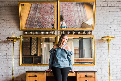 A professional portrait of Chicago wedding photographer Ashley, specializing in candid, film-inspired, and timeless wedding photography for modern couples.
