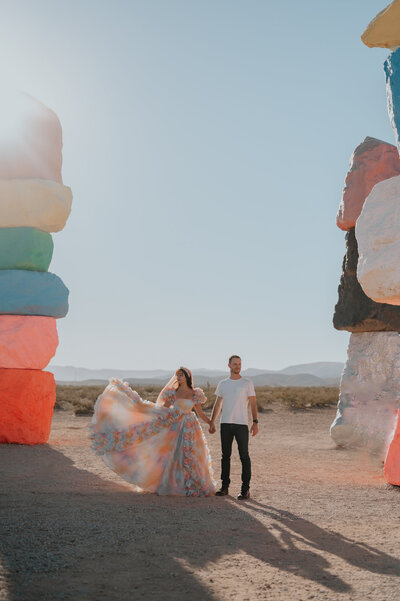 a ciuple who just renewed their vows in las vegas nevada at the seven magic mountains