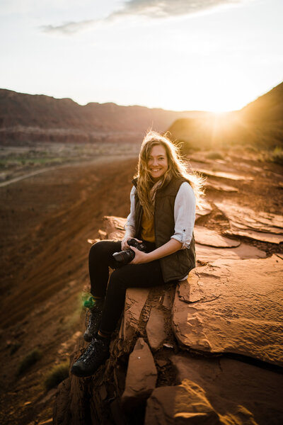 the adventure wedding and elopement photographer aimee flynn dances in Moab