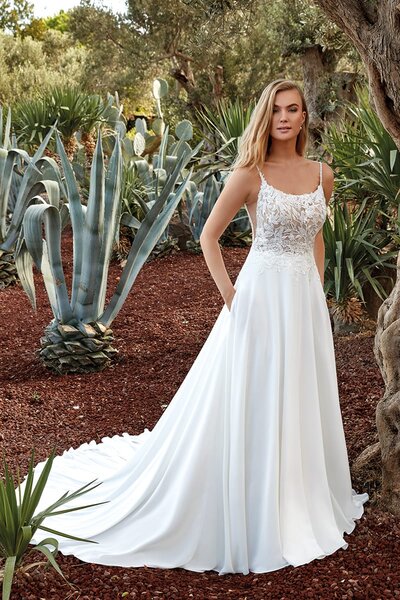 For brides of the effortlessly cool persuasion, we present a unique lace bridal dress featuring a flattering neckline and a shimmery statement back.