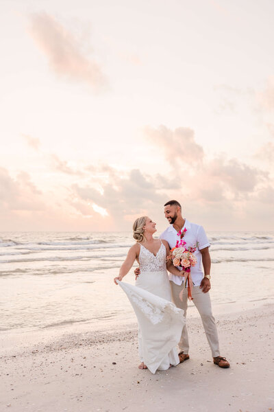 The newlyweds share a loving gaze during their St. Pete elopement, beautifully captured in this romantic portrait.