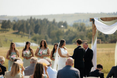 The bride and groom kissing.