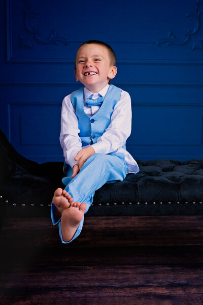 Little boy giggles in formal wear by Melissa Byrne Photography