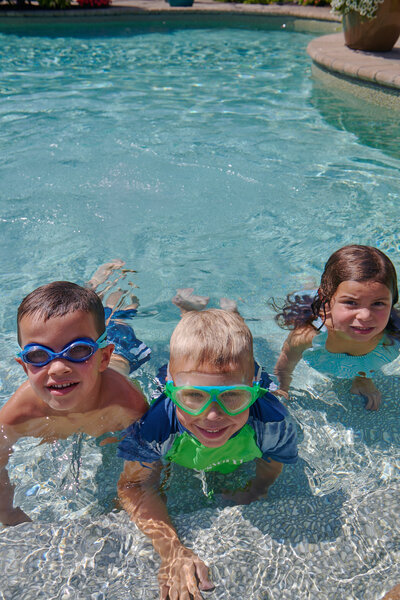 Children enjoying in the pool, delighting in the simple pleasures of water play and shared laughter