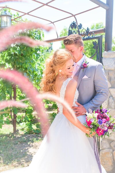 A Charlotte bride and groom hold each other close