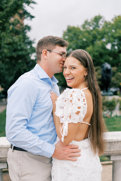 Man kissing Austin bride to be on the head taken by Austin wedding photographer