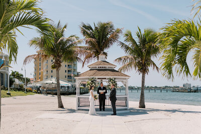 Private beach location for intimate weddings and elopements in Florida. Very picturesque and versatile with waterfront views, palm trees, gazebo, yachts and golf course.