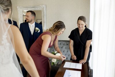 Jessica Young at wedding with bride and groom