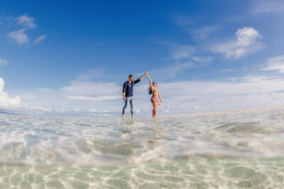 couple dancing on sandbar