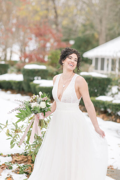 Bride outside in snow at Linwood Estate on wedding day