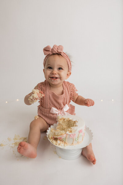 newborn photographer holding camera and smiling in Fargo