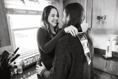 Husband and wife holding sonogram during maternity session in Chicago, IL