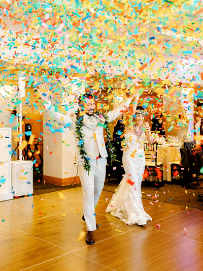 reception grand entrance photo of bride and groom with confetti