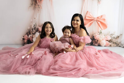 Fine art mommy and me session with mother and two daughters wearing couture gowns near San Antonio