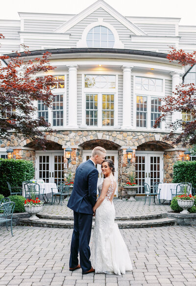 Bride and Groom pose for photos at the Olde Mill Inn in New Jersey