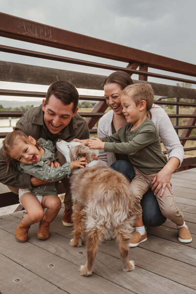 Happy family outside on a bridge