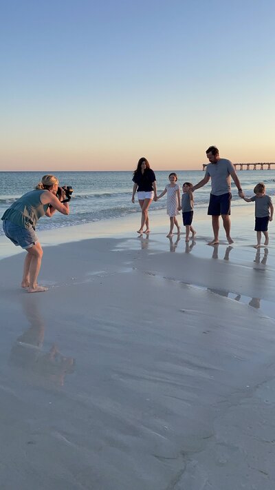 Ann Mangum photographing family at Navarre Beach