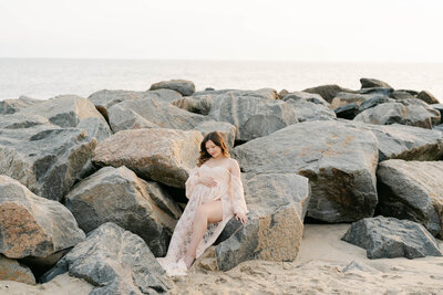 pregnant mother on the beach during a maternity session in Delaware