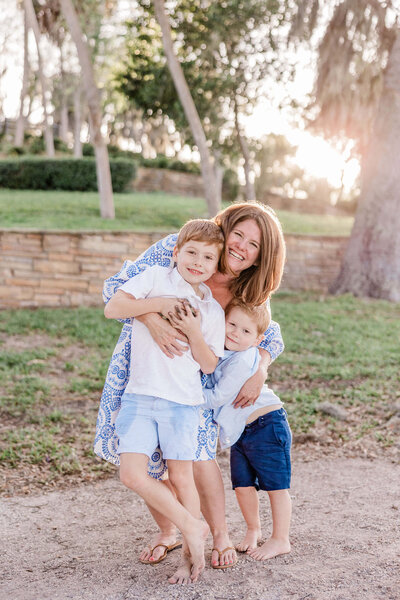 family gets photos taken in Philippe Park with a St. Pete family photographer