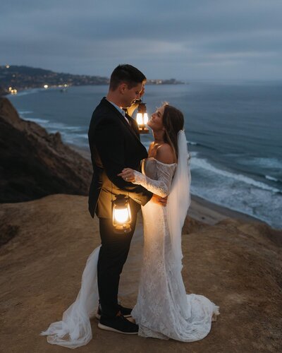 bride and groom with lanterns in san diego