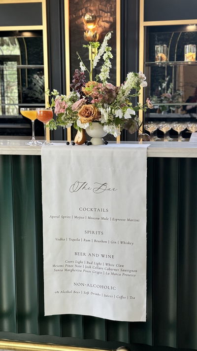 Fabric bar sign with modern typography and script accents