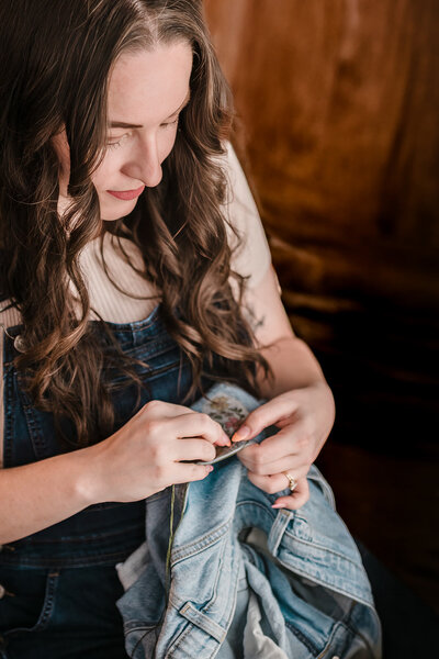 Close-up of small business owner working on her craft in home studio in New Braunfels, Texas.