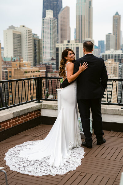 Bride and Groom posing for their first look on top of the Ambassador Hotel in downtown Chicago.